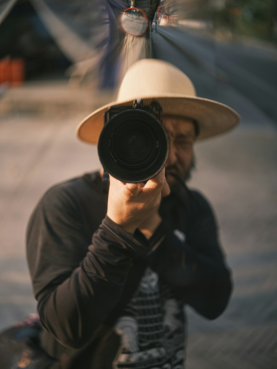Photographer taking a portrait of a client outdoors